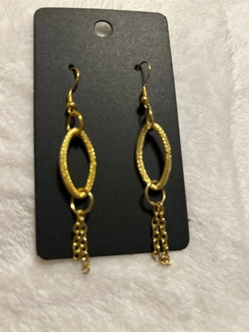 Gold tone dangled oval earrings